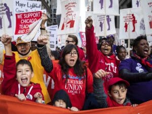 Members of the Chicago Teachers Union and SEIU Local 73 and their supporters march through the Loop after a rally, three days before the unions could walk off the job on strike, Monday, Oct. 14, 2019, in Chicago.