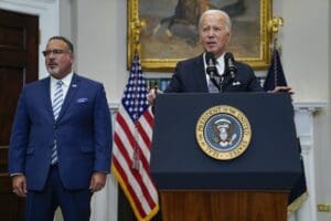 President Joe Biden speaks in the Roosevelt Room of the White House, June 30, 2023. Education Secretary Miguel Cardona listens at left. (AP Photo/Evan Vucci, File)